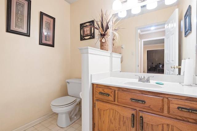 bathroom with vanity, tile patterned floors, and toilet