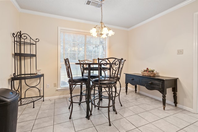 tiled dining area with an inviting chandelier and ornamental molding