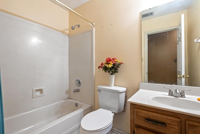 full bathroom featuring vanity, bathtub / shower combination, and toilet