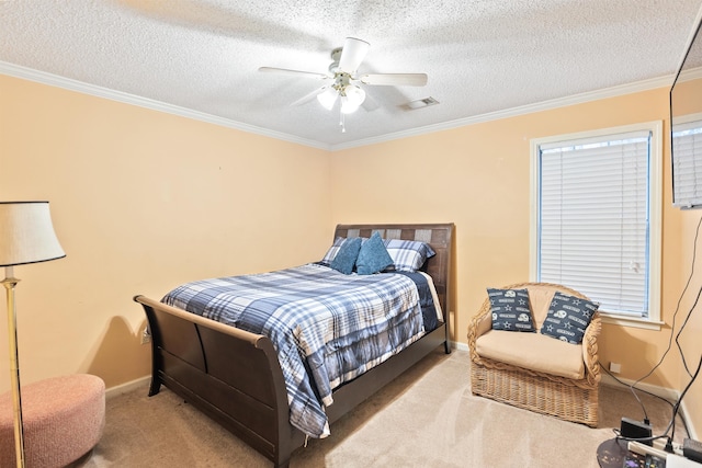 bedroom with crown molding, a textured ceiling, and carpet