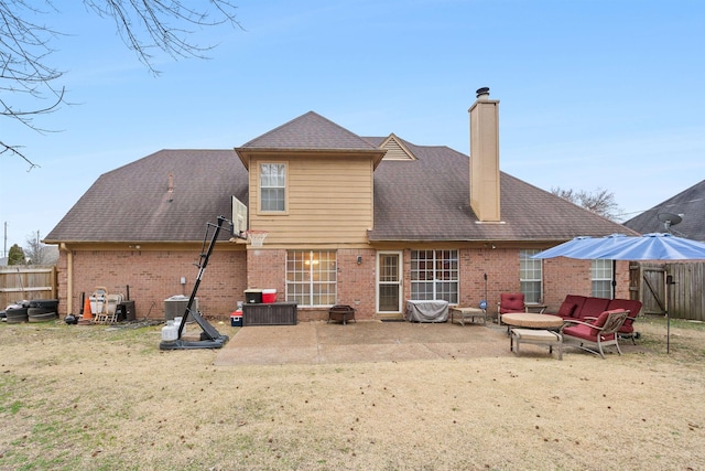 back of property featuring a patio area, central air condition unit, and a lawn