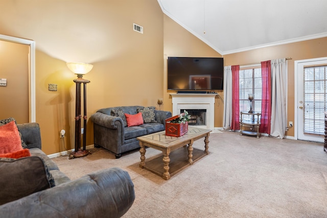 living room with ornamental molding, high vaulted ceiling, and light carpet