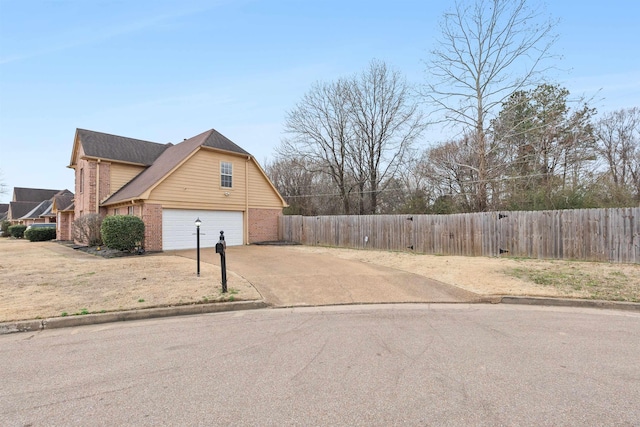 view of side of property with a garage