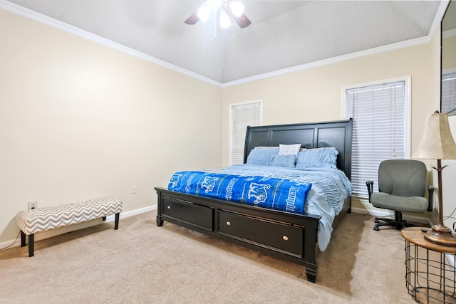 carpeted bedroom featuring lofted ceiling, crown molding, and ceiling fan