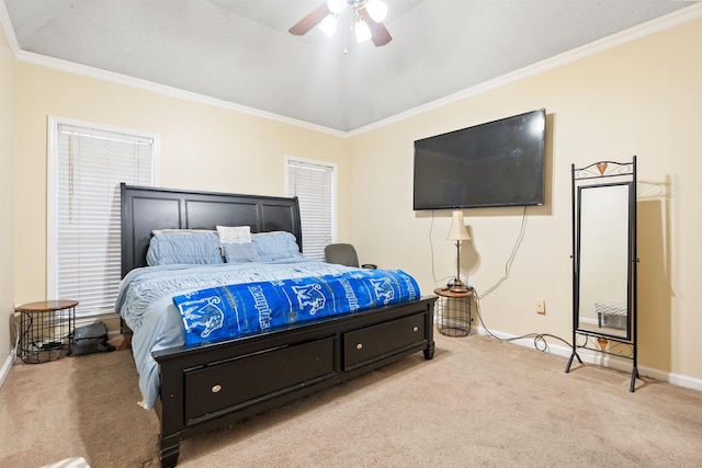 carpeted bedroom featuring ceiling fan and ornamental molding