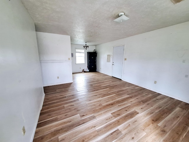 interior space featuring hardwood / wood-style floors and a textured ceiling