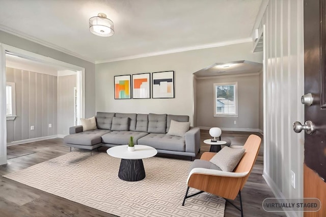 living room with ornamental molding and wood-type flooring