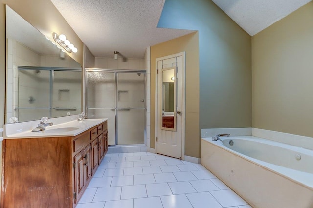 bathroom with shower with separate bathtub, vanity, and a textured ceiling