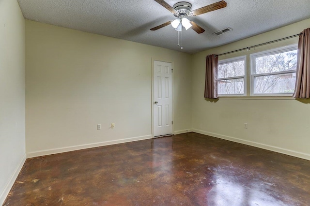 spare room with ceiling fan and a textured ceiling