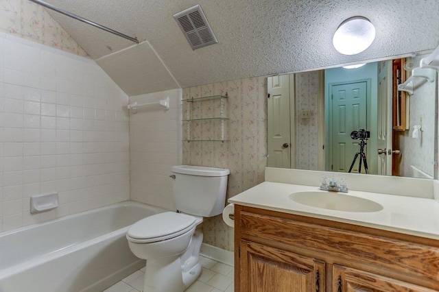 full bathroom featuring lofted ceiling, vanity, toilet, tile patterned floors, and a textured ceiling