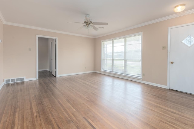 interior space featuring hardwood / wood-style floors, ornamental molding, and ceiling fan