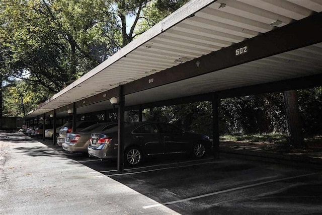 view of parking / parking lot with a carport