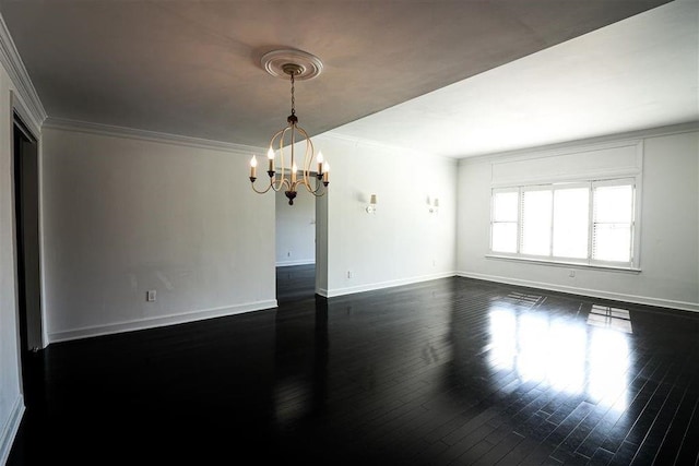 unfurnished room with crown molding, dark hardwood / wood-style floors, and a notable chandelier