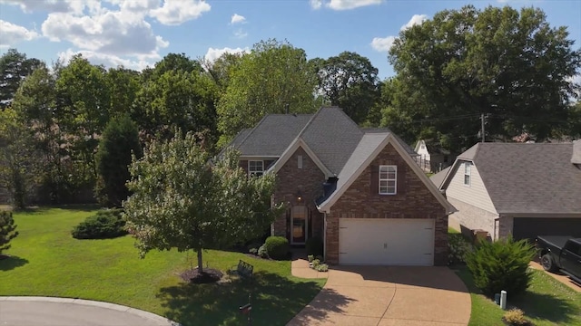 view of front facade with a garage and a front yard