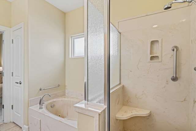 bathroom featuring independent shower and bath and tile patterned flooring