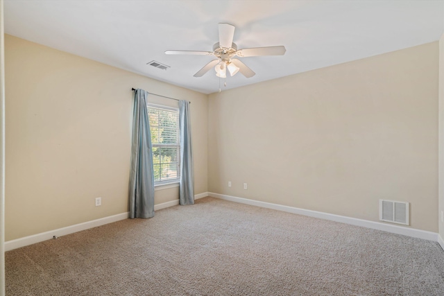 carpeted empty room featuring ceiling fan