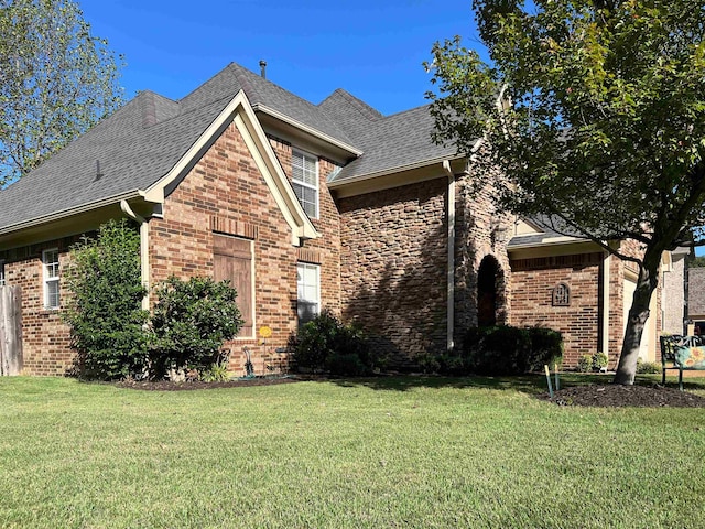 view of home's exterior featuring a lawn