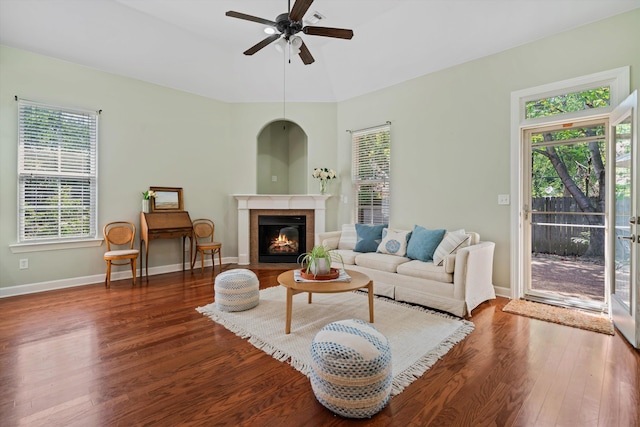 living room featuring wood-type flooring and ceiling fan