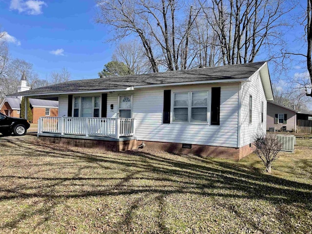 ranch-style home with covered porch and a front lawn