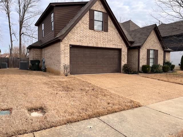 view of side of property featuring a garage