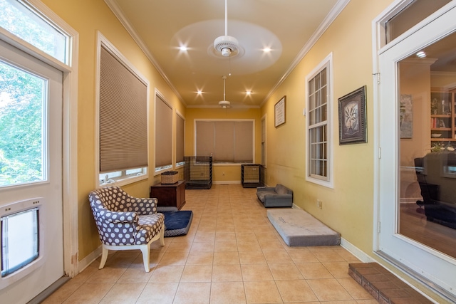 interior space featuring ornamental molding and light tile patterned floors