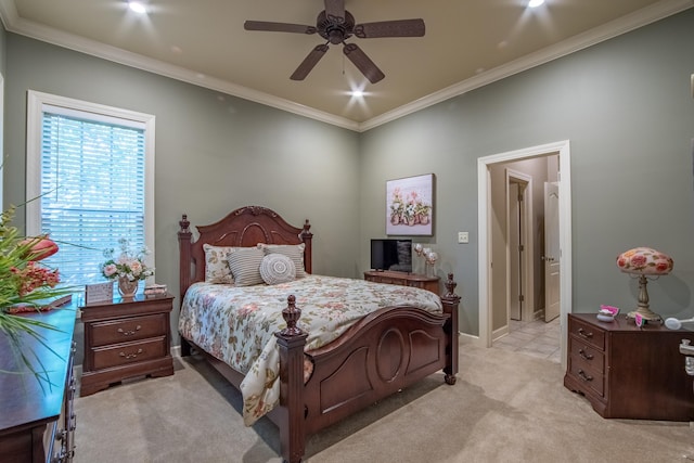 bedroom with ornamental molding, light colored carpet, and ceiling fan