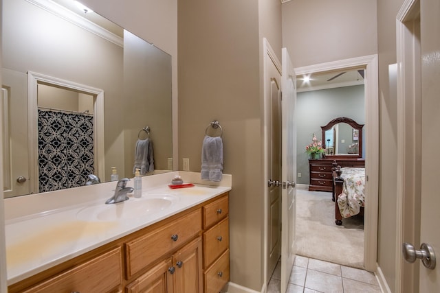 bathroom featuring vanity, crown molding, and tile patterned floors