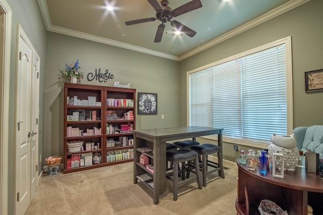 office space with ornamental molding, light carpet, and ceiling fan