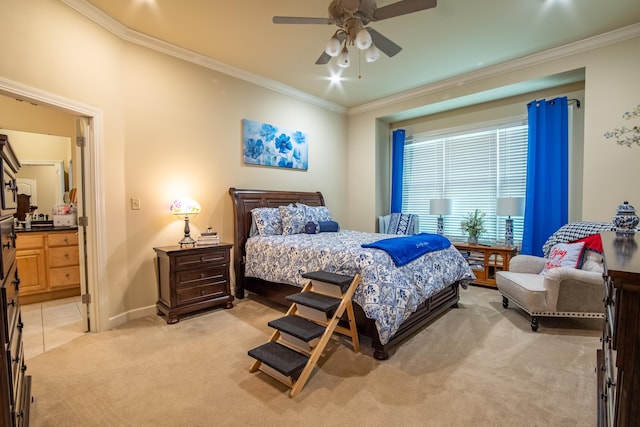 carpeted bedroom with ornamental molding, ceiling fan, and ensuite bathroom