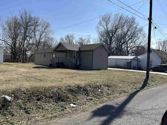 single story home with a porch and a front lawn