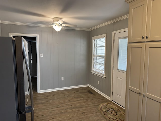 kitchen with stainless steel refrigerator, ceiling fan, ornamental molding, and dark hardwood / wood-style flooring