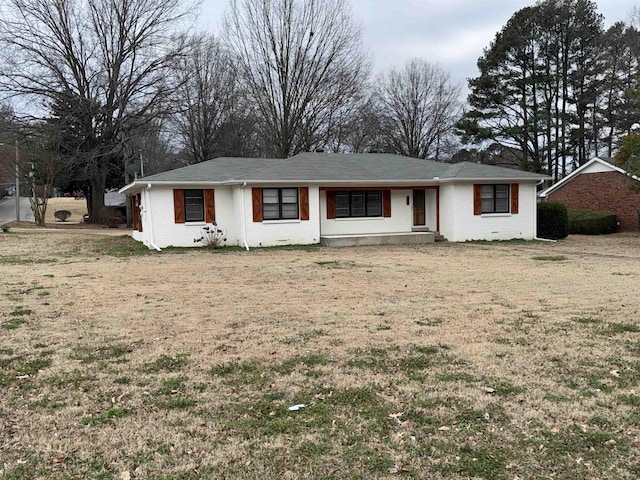 ranch-style home with a front yard