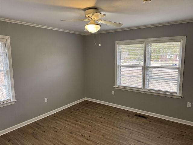 unfurnished room featuring ornamental molding, ceiling fan, and dark hardwood / wood-style flooring