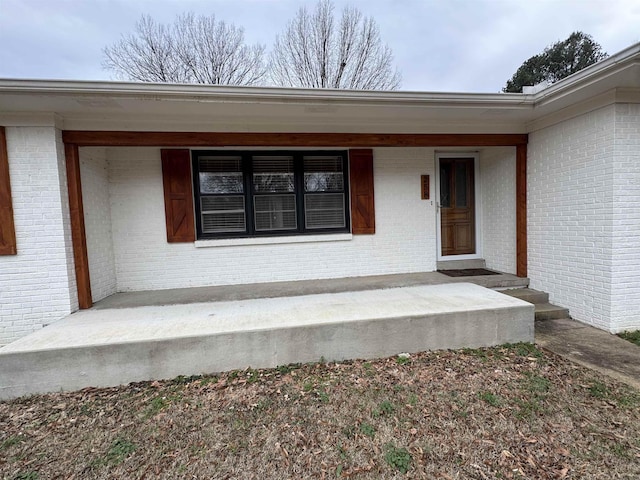 entrance to property with a porch