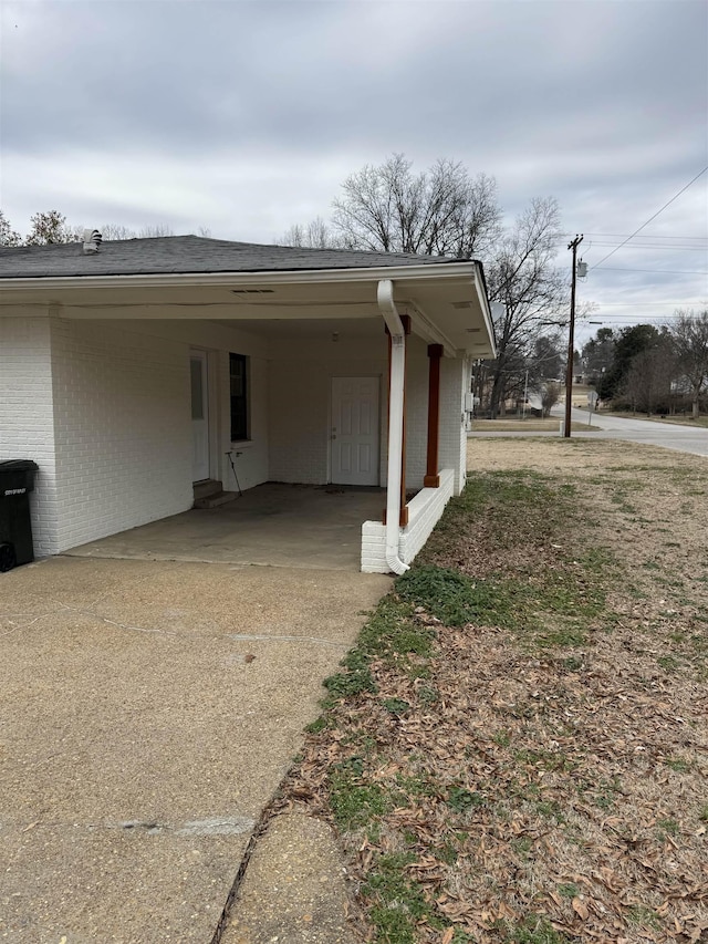 exterior space featuring a carport