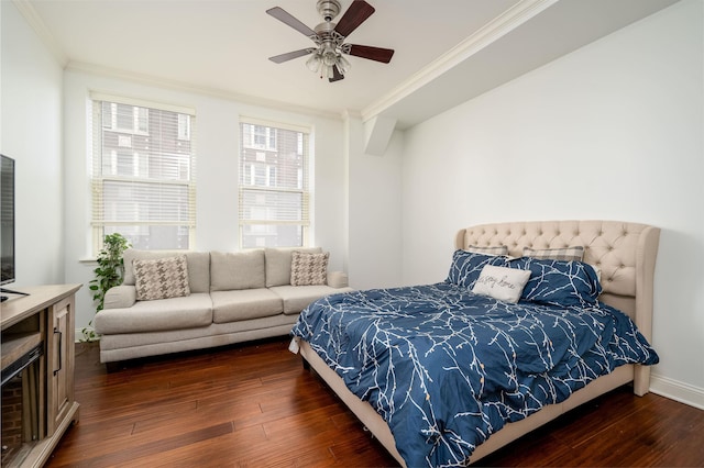 bedroom with ornamental molding, dark hardwood / wood-style floors, and ceiling fan