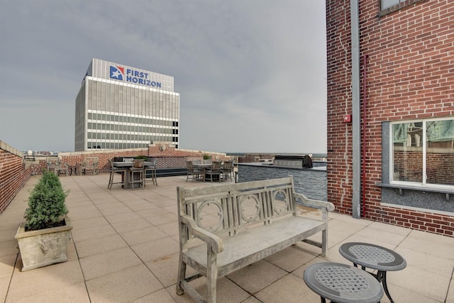 view of patio / terrace with a water view