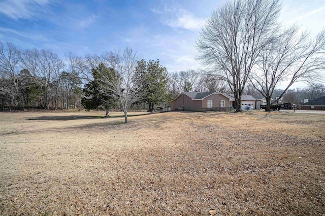 view of yard with an attached garage