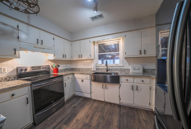 kitchen with black fridge with ice dispenser, white dishwasher, stainless steel electric stove, under cabinet range hood, and a sink