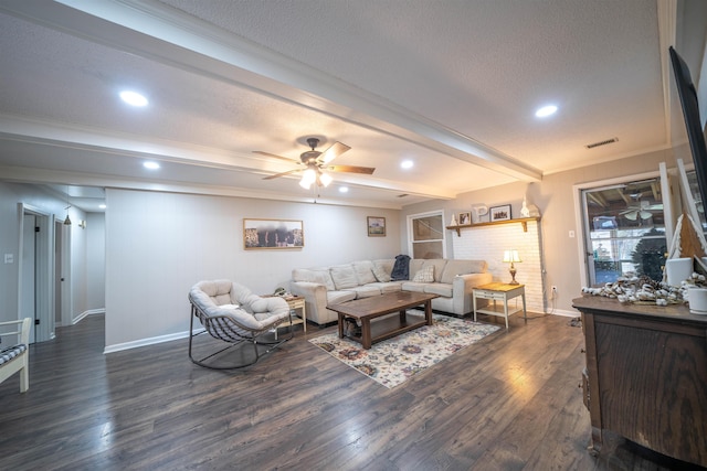 living area featuring a textured ceiling, beam ceiling, dark wood finished floors, and visible vents