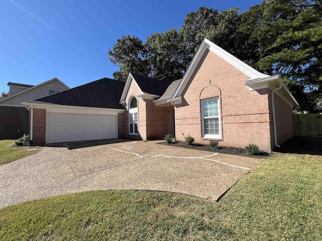 view of front of home featuring a garage and a front yard