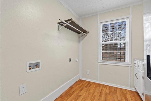 laundry room featuring hookup for a washing machine, crown molding, hookup for an electric dryer, and light hardwood / wood-style floors