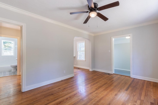 unfurnished room featuring hardwood / wood-style floors, crown molding, and ceiling fan