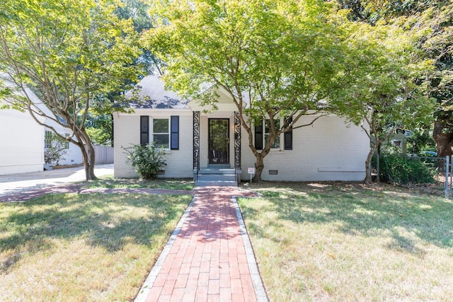 view of front of home with a front lawn