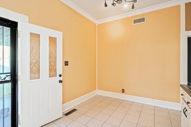 interior space with crown molding and light tile patterned floors