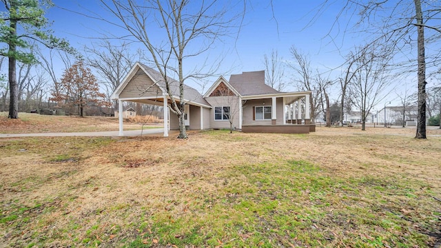 view of front of house with a porch and a front yard