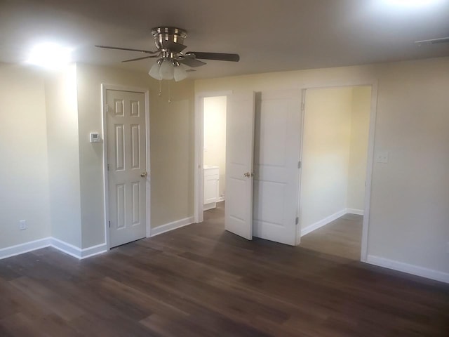 interior space featuring dark hardwood / wood-style floors and ceiling fan