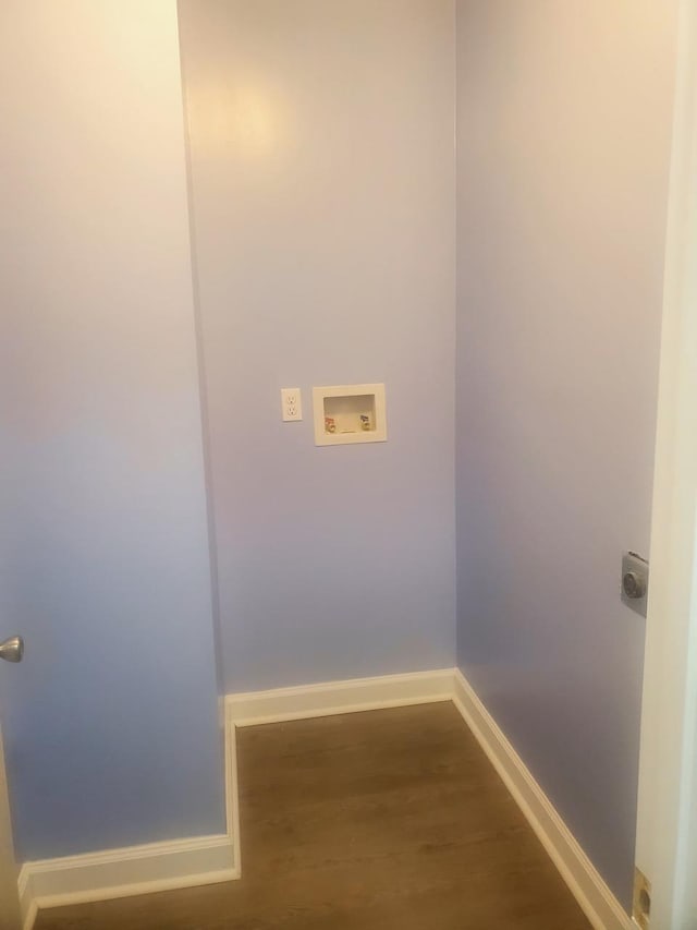 washroom featuring dark hardwood / wood-style floors, hookup for a washing machine, and electric dryer hookup