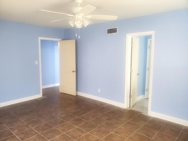 unfurnished room with ceiling fan