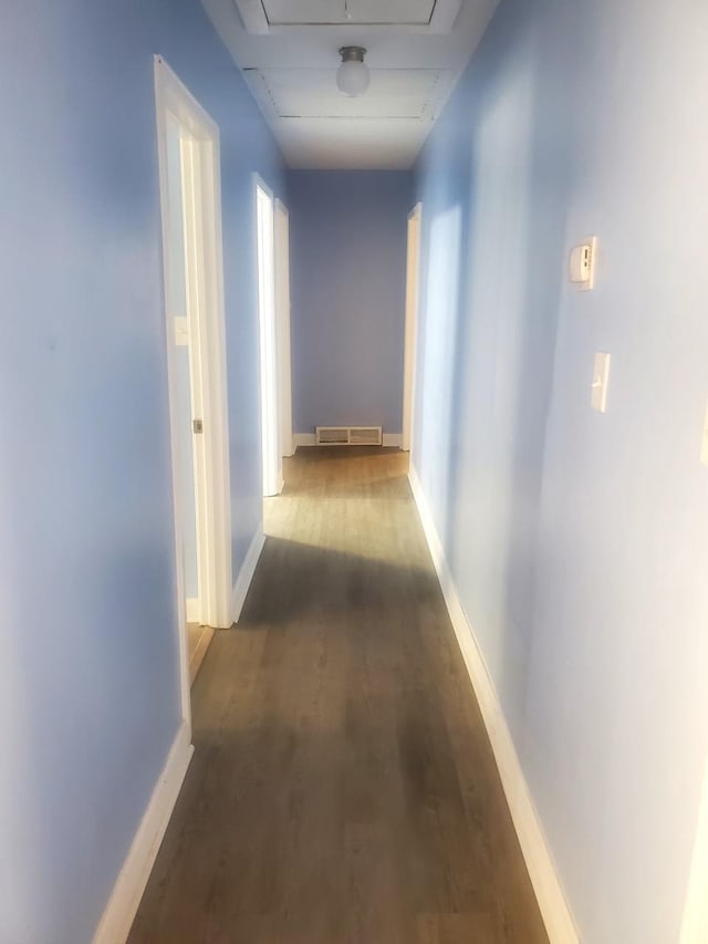 corridor with dark hardwood / wood-style floors